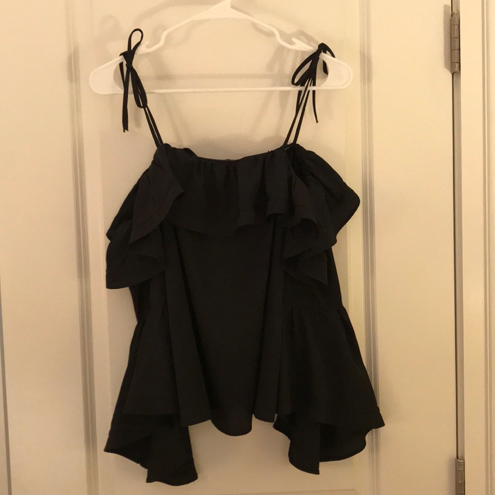 Likely NWT black off the shoulder flounce top!